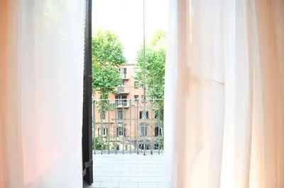 an open window with a view of a building at Maison Margaret in Rome