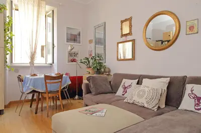 a living room with a couch and a table at Cozy Esquilino - My Extra Home in Rome