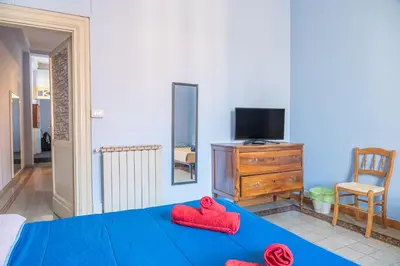 a room with a bed with two red hearts on it at Lion Renting Metro Piramide in Rome