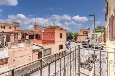 a view of a city from a balcony at Pìgneto Roma Good Vibes Apartment in Rome