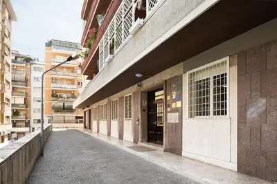 an empty street in front of a building at Vatican Loft - Musei Vaticani in Rome