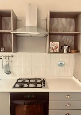 a kitchen with a stove top oven in a kitchen at Monteverde 65 in Rome