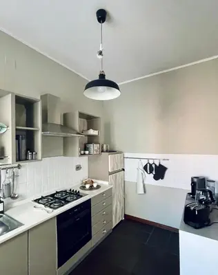 a kitchen with a stove top oven next to a sink at Monteverde 65 in Rome