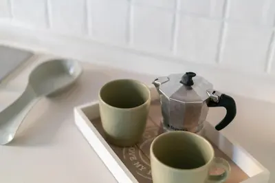 two cups and a tea pot on a tray at Monteverde 65 in Rome
