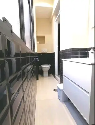 a bathroom with a sink and a toilet in it at Piazza di Spagna Suite in Rome