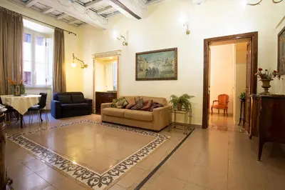 a living room with a couch and a table at Domus Minervae in Rome