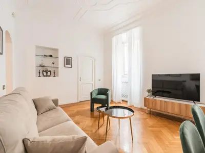 a living room with a couch and a table at The Best Rent - Splendid three-bedroom apartment near the Trevi Fountain in Rome