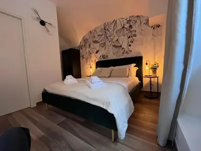 a bedroom with a bed with towels on it at Giorgina Garden&Rooms in Rome