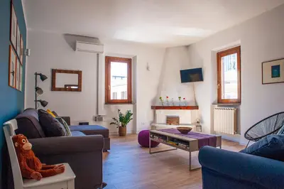a living room with two couches and a table at Casa Luce 66 in Rome