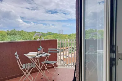 a balcony with a table and chairs on a balcony at YCH-Rifugio incantato sul Tevere in Rome