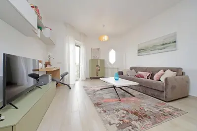 a living room with a couch and a table at YCH-Rifugio incantato sul Tevere in Rome