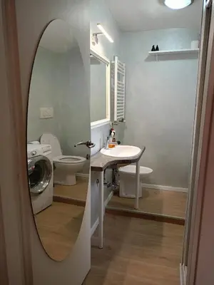 a bathroom with a sink and a mirror at DELIGHTFUL LOFT IN PlGNETO in Rome