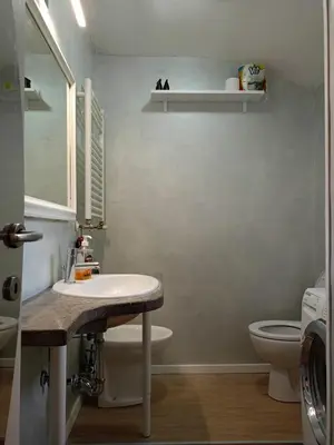 a bathroom with a sink and a toilet at DELIGHTFUL LOFT IN PlGNETO in Rome