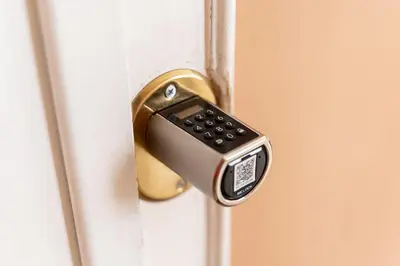 a door handle with a cell phone in it at RomeCornelia Apartment - Musei Vaticani - San Pietro in Rome