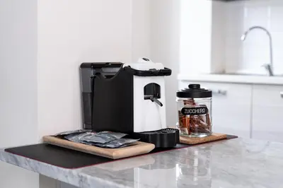 a coffee maker on a counter in a kitchen at RomeCornelia Apartment - Musei Vaticani - San Pietro in Rome