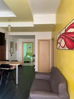 a living room with a couch and a table at Alloggio di Raffaello L in Rome