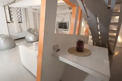 a living room with a table and a mirror at Space Home in Rome
