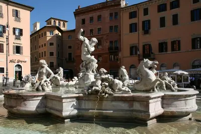 a fountain in the middle of a city with animals on it at Space Home in Rome