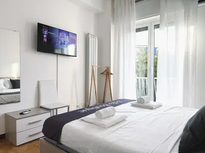 a bedroom with a bed with a tv on the wall at Bella Boutique in Rome