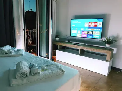 a bedroom with a bed and a television on a table at Bella Boutique in Rome