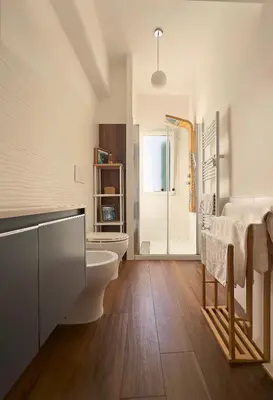 a bathroom with a toilet and a sink and a shower at Trastevere Station House in Rome
