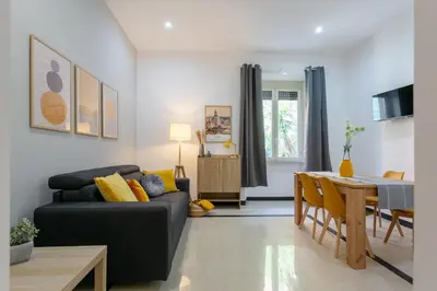 a living room with a couch and a table at Mustard Apartment S Camillo - Holiday Homes Rome in Rome