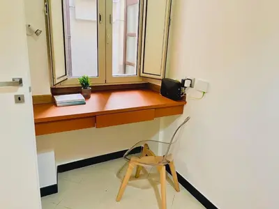 a wooden window sill with a chair in a room at Mustard Apartment S Camillo - Holiday Homes Rome in Rome