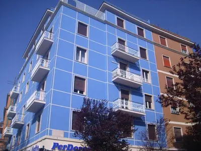 a blue building with balconies on the side of it at Mustard Apartment S Camillo - Holiday Homes Rome in Rome
