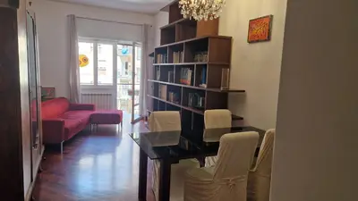 a bedroom with a bed and a desk and a window at Via Tiburtina vicino Università e Stazione intero appartamento per la tua vacanza a Roma in Rome