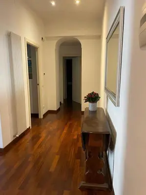 a hallway with a table with a plant on it at Roma Termini Barbara House in Rome