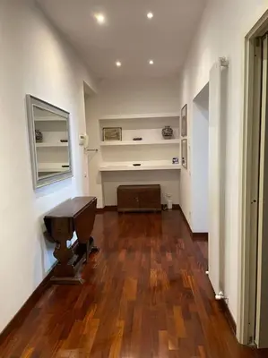 an empty room with a piano and a wooden floor at Roma Termini Barbara House in Rome