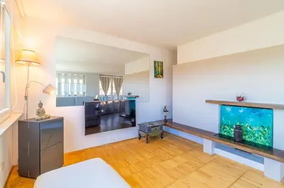 a living room with a fish tank and a couch at Imperial Rome Accommodation terrazza sul vaticano in Rome