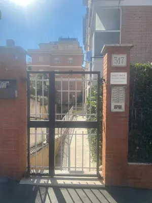 an entrance to a building with an open door at Malu's house in Rome