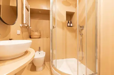 a bathroom with a sink and a shower at Reale Vatican House in Rome