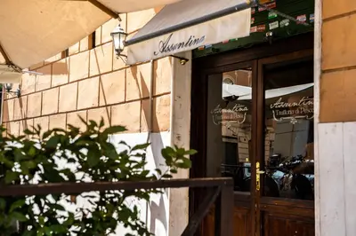 a store front with a sign on the door at Testaccio Design Apartment Rome in Rome