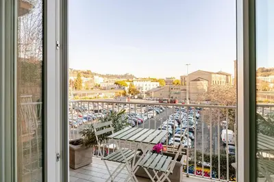 a balcony with a view of a parking lot at Roma Vatican City in Rome