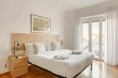 a bedroom with a large bed with two towels on it at Roma Vatican City in Rome