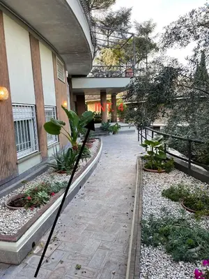 a building with a courtyard with plants and a walkway at Loft 643 in Rome