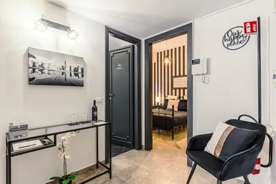 a living room with a desk and a chair at Caracalla garden House in Rome