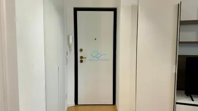 a white door with a sign on it in a room at Chic Studio in piazza Bologna in Rome