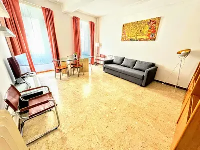 a living room with a couch and a glass table at colosseobb in Rome