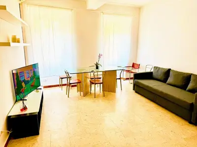 a living room with a couch and a glass table at colosseobb in Rome