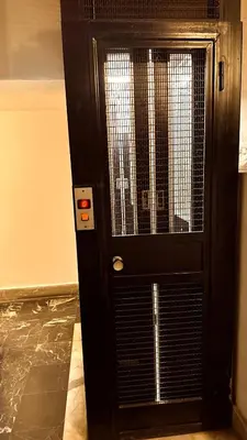 a black door with a cage in a room at colosseobb in Rome