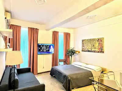 a hotel room with a bed and a couch at colosseobb in Rome