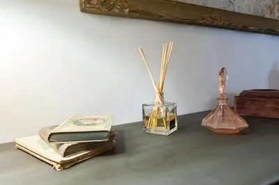 a table with books and other items on it at Trastevere Luxury, ampia e confortevole location sospesa tra design e storia in Rome
