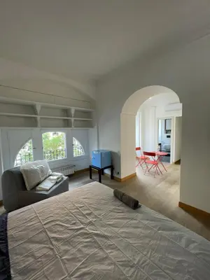 a bedroom with a bed and a living room at Giulia Mesa Suites in Rome