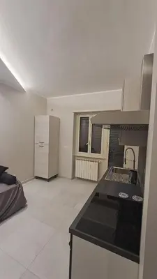 a kitchen with a sink and a stove in a room at Holiday Space Roma in Rome