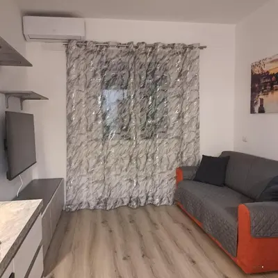 a living room with a couch and a window at Le tue vacanze a Roma-2 bagni-nuovo apt in Rome