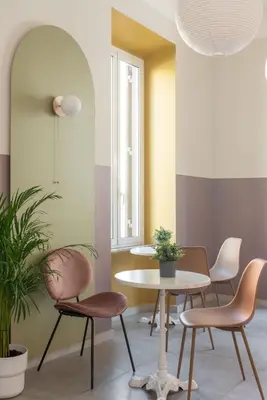 a dining room with two chairs and a table at Hotel Infinito - Gruppo BLAM HOTELS in Rome