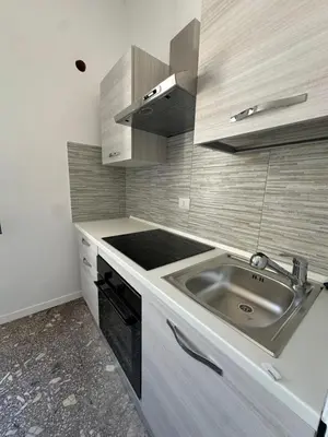 a small kitchen with a sink and a stove at Smart Home in Rome